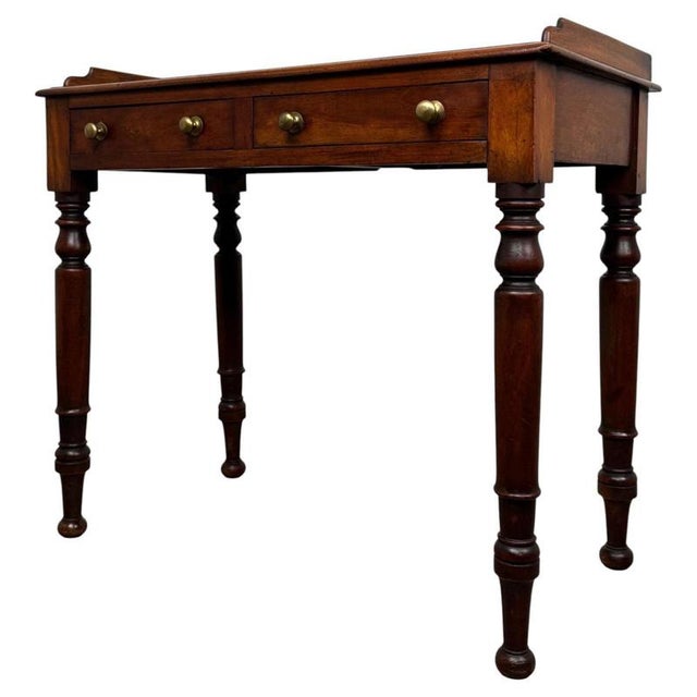A beautifully proportioned 19th-century victorian mahogany writing table, combining elegant traditional styling, practical...
