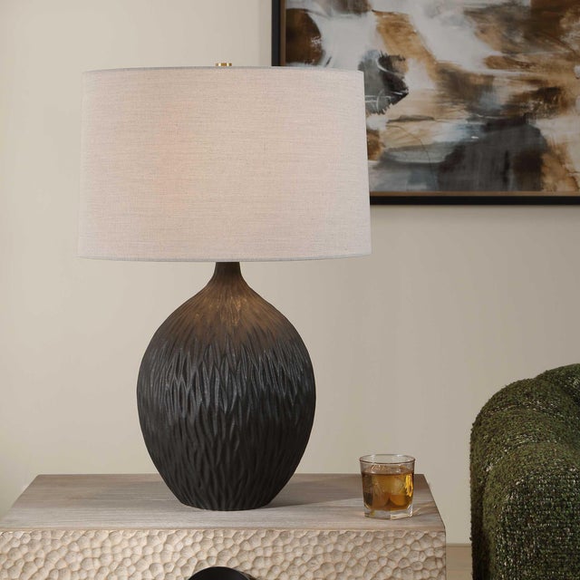 The Levee Table Lamp Features A Simple Shaped Ceramic Base That Is Enhanced With A Repeating Chiseled Pattern, Finished In...