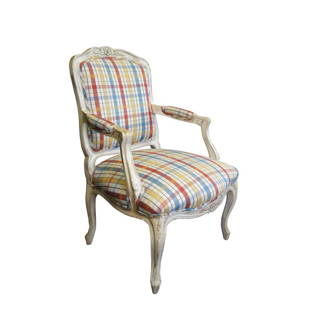 Vintage French Provincial / Louis XV style arm chair. Made of walnut featuring carved floral and serpentine design with...