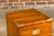 A small English 19th century Campaign chest by Bissitt & Brunton LTD, with two drawers, brass hardware and bracket feet....