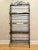 Vintage French Style Four Tier Scrolled Wrought Iron & Brass Baker's Rack Preowned and in good condition. The brass does...