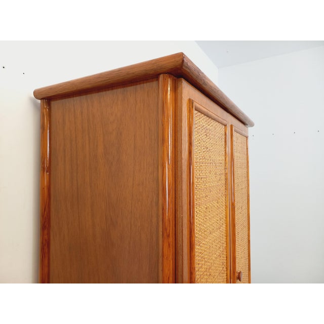 Vintage 1970s wardrobe, attributed to the Maugrion brand and produced by Roche-Bobois, made of woven rattan and wood, with...