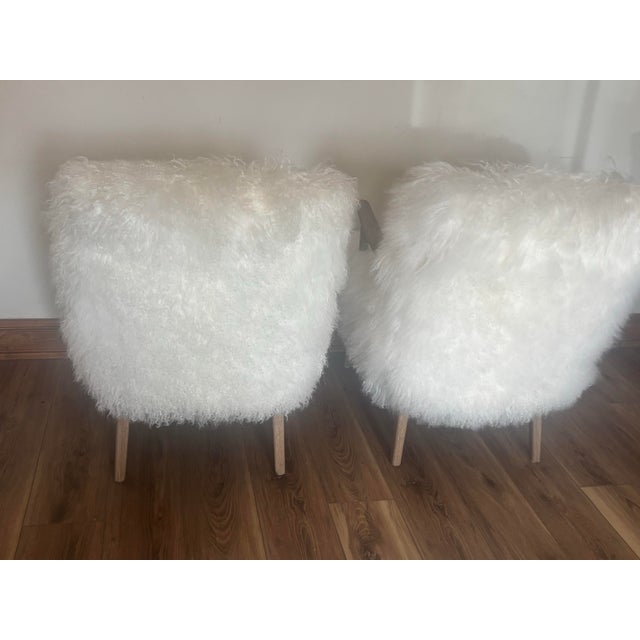 Elevate your living space or primary suite with this set featuring two Four Hands "Ashland" armchairs. Designed with an...
