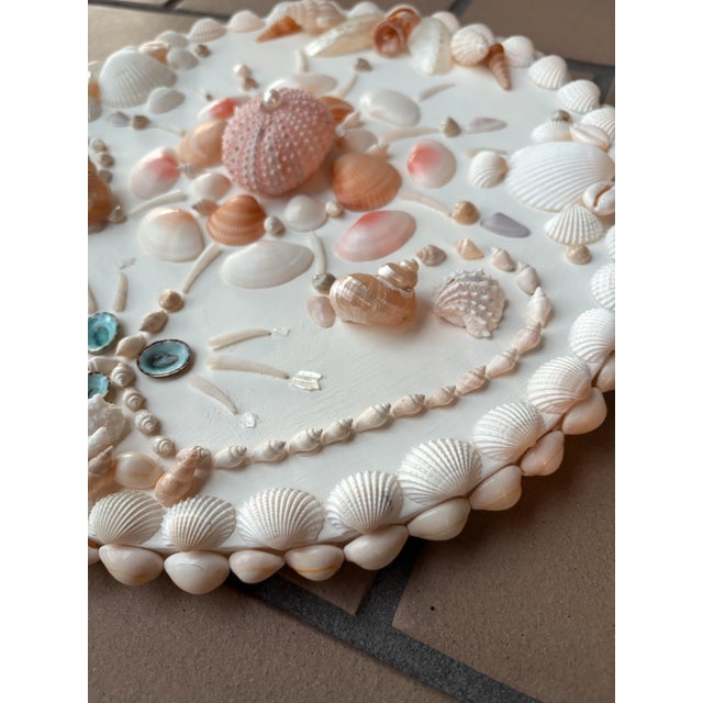 Coastal luxury circular shell wall panel on antique white background. Measures 12.5”. Will come signed, dated and ready to...