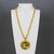 This spectacular Pauline Rader necklace features an important, dimensional pendant design with shiny, gilded metal framing...