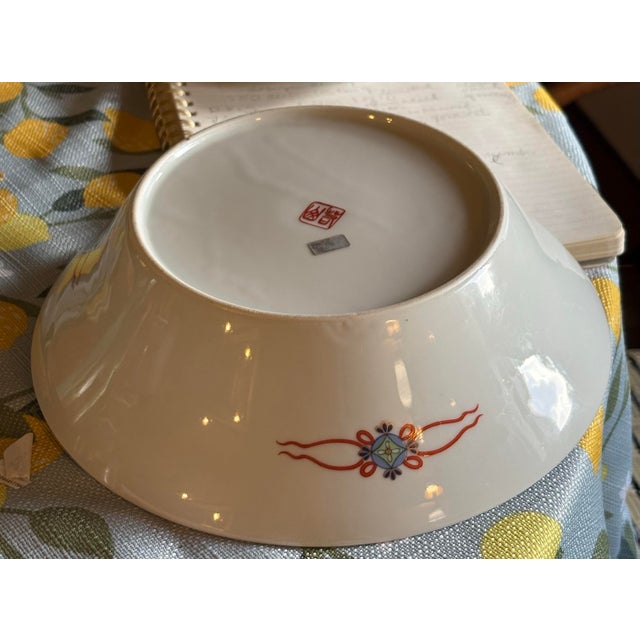 A vibrant mid century porcelain bowl. Central floral medallion. A signature Imari composition. Imari Ko/Imari revival. Mid...