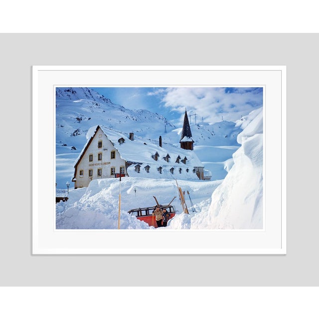 A Hotel In The Mountains by Toni Frissell Skiers and a VW ski bus in front of the Alberg Hozpis Hotel, St. Anton, Austria,...