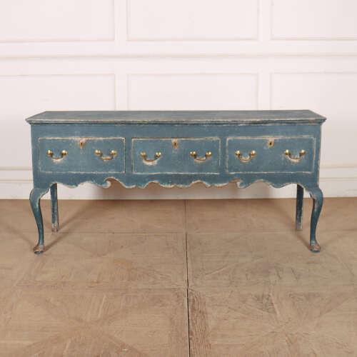 Good 18th century English painted three drawer cabriole leg oak dresser base. 1780. This piece is designed in the style of...