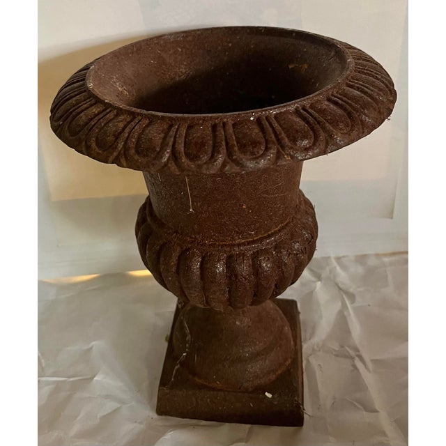 A nice old rustic garden urn in classic design.