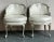 Presenting a stunning pair of vintage lounge chairs, exuding the opulent charm of Regency and Baroque design. These chairs...
