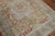 An accent size 20th century Persian Heriz rug in apricot rust and soft blue tones Measures: 4'6" x 6'3" Heriz antique...