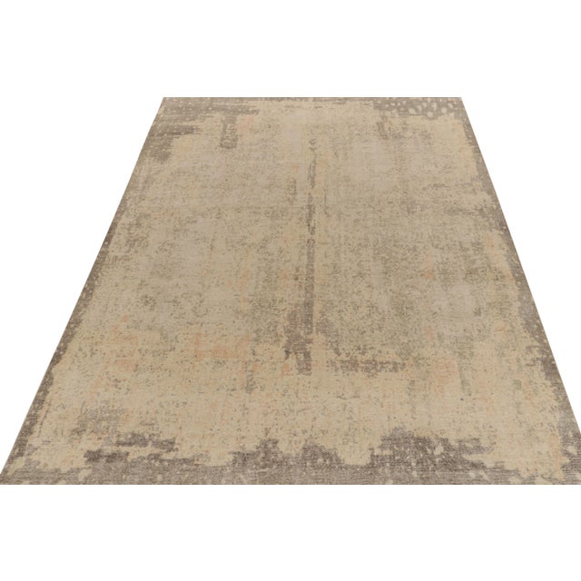 From Rug & Kilim’s Homage collection, a 10x14 distressed style abstract rug relishing a chic, yet gentle play of luscious...