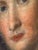 Oil on panel depicting the portrait of an elegant lady, bust-length, wearing a low-cut blue dress and adorned with a...