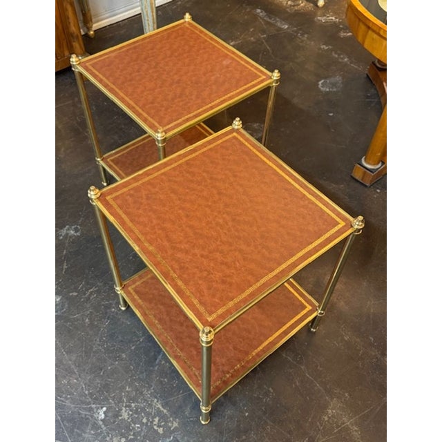 The Pair of Jansen Manner Leather and Brass Side Tables is a stylish addition to any living space. Made with high-quality...