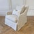 Linen slip covered swivel chair. Slip cover made out of 100% natural Belgian Linen. Seat is feather cloud. Measures: 31” W...