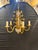 A circa 1930’s French gilt metal chandelier with crystal parts. 5 lights