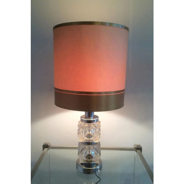 This pair of lamps is made of glass and chrome. This is a French work. Circa 1960.