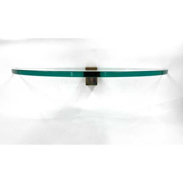 Wall-Mounted Shelf in Brass and Glass from Peter Ghyczy, 1970s, in Flawless conditions. Designed 1970 to 1979 This piece...