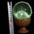 This is a rare and unusual Buddhist relic sphere, described as a "regenerated sarira" containing an etched image of a...