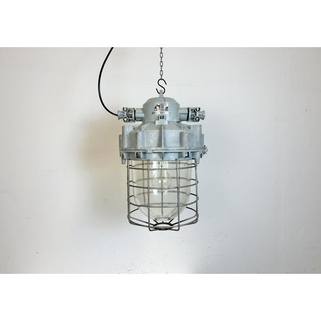 Industrial factory hanging light designed in 1970s and produced till 1990s by Elektrosvit in former Czechoslovakia. It...