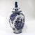 This Delft lidded vase, or ginger jar urn, boasts a classic blue and white floral design that highlights traditional Dutch...