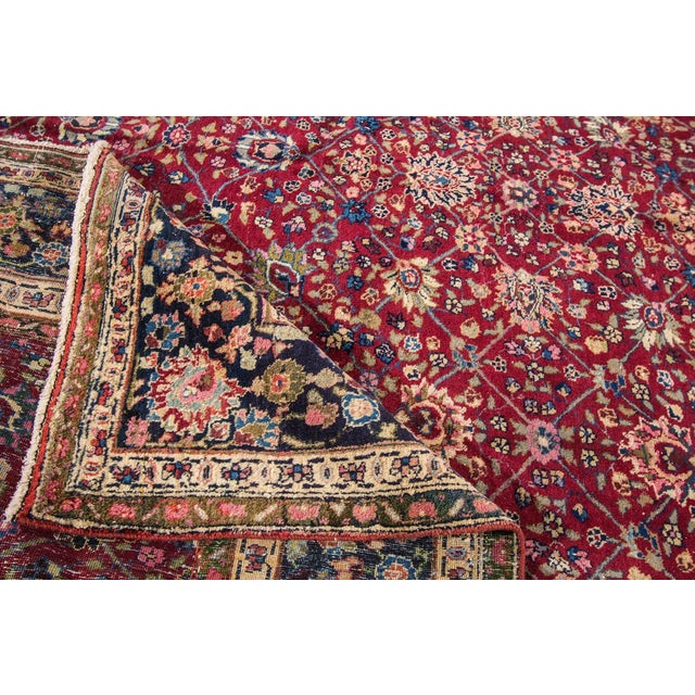 Beautiful hand-knotted wool, vintage Tabriz rug. This rug has a rust field with an all over floral design and multicolored...
