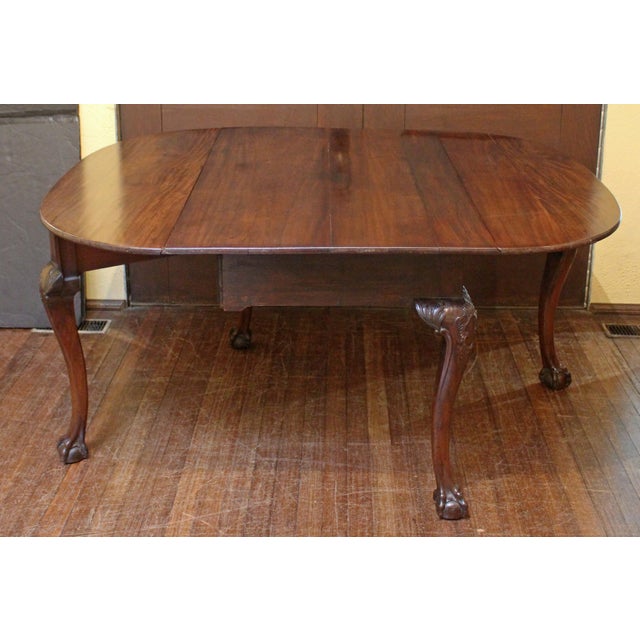 Circa 1730-50 Irish drop leaf table. Mahogany, raised on cabriole legs with sculptural cartouche & acanthus carved knees &...