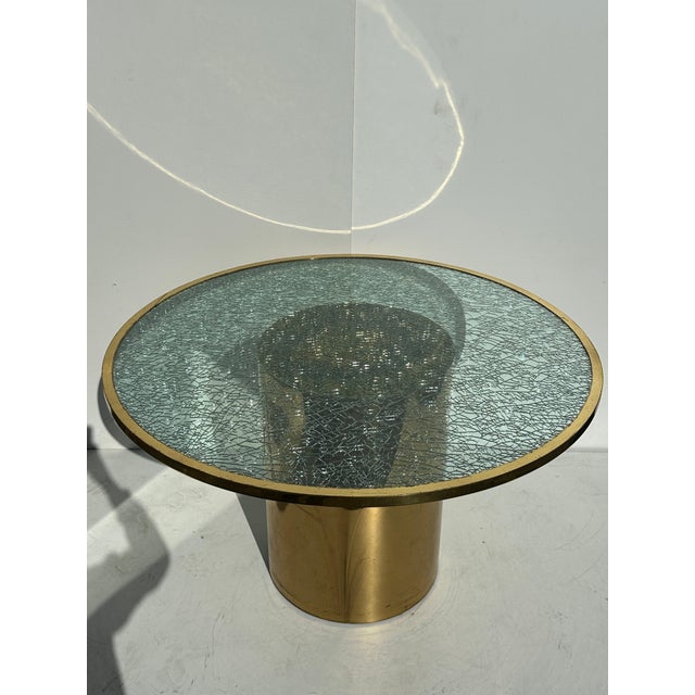 Crackled grass and brass dining or occasional table in the manner of Steve Chase. Brass base is 20" diameter x 28" high....