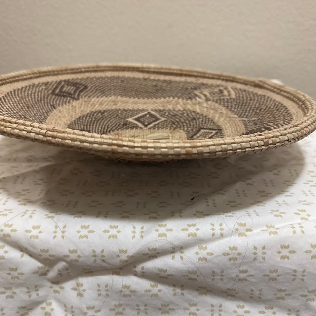 Vintage Tonga basket handwoven by artisans of the Tonga people of Southern Africa using traditional twining techniques...