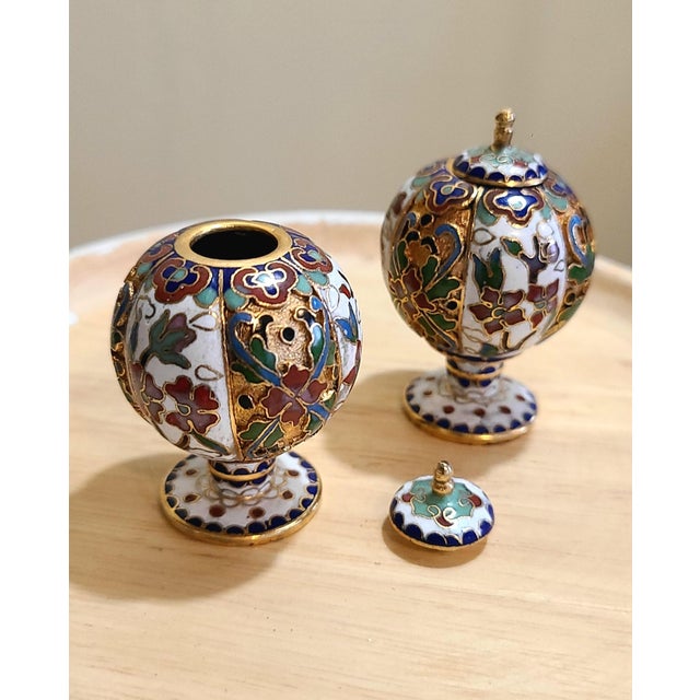 Set of two Cloisonne enamel on brass Chinese ginger jar minis. Purchased in China with a travel tour. Approximately 2.5in.