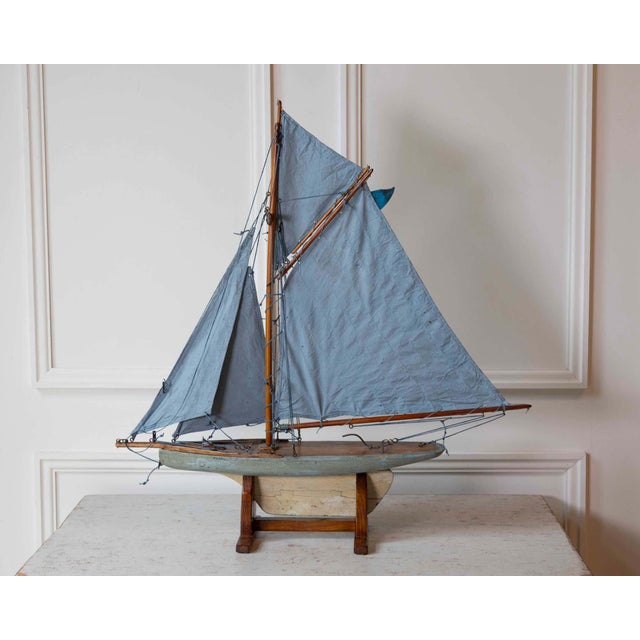 Made in Norfolk, England, in the twentieth century and attributed to Bowman, this carved wooden pond yacht is rigged as a...