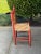 Charming 1940s low-back chair from Mexico. Great corral color. Vintage "HECHO EN MEXICO" stamp on the underside....