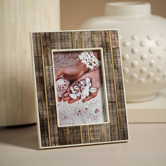 This charming rustic frame is handmade by the finest artisans. Constructed from horn and bone, and inlaid with brass, the...