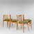 An elegant and meticulously restored set of four dining chairs from the 1960s, a superb testament to 1960s Italian...