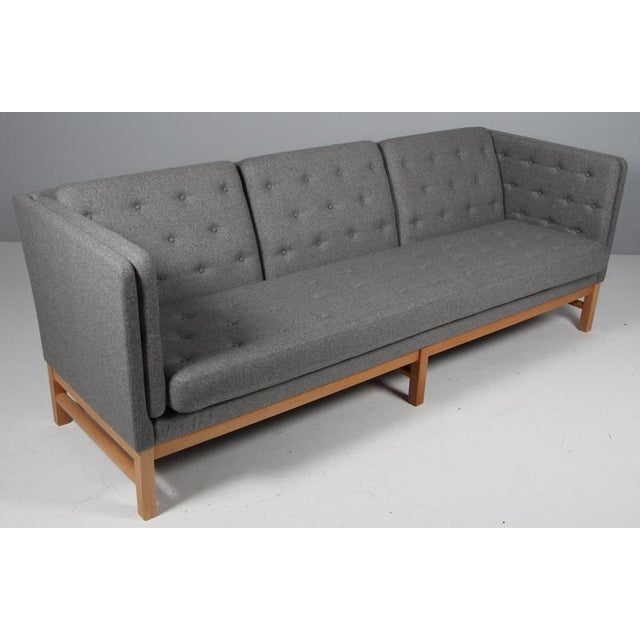 Erik Jørgensen three-seat new upholstered with Stone Magrethe wool. Frame of oak. Model EJ 315/3, made by Erik Jørgensen....