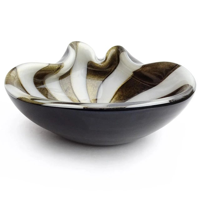 Beautiful vintage Murano hand blown black, gold flecks and white stripes Italian art glass bowl. Documented to designer...