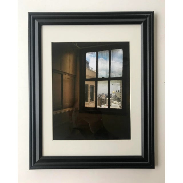 This industrial art photo features a view through a NYC factory window that has just about seen it all. Abandoned? Or in...