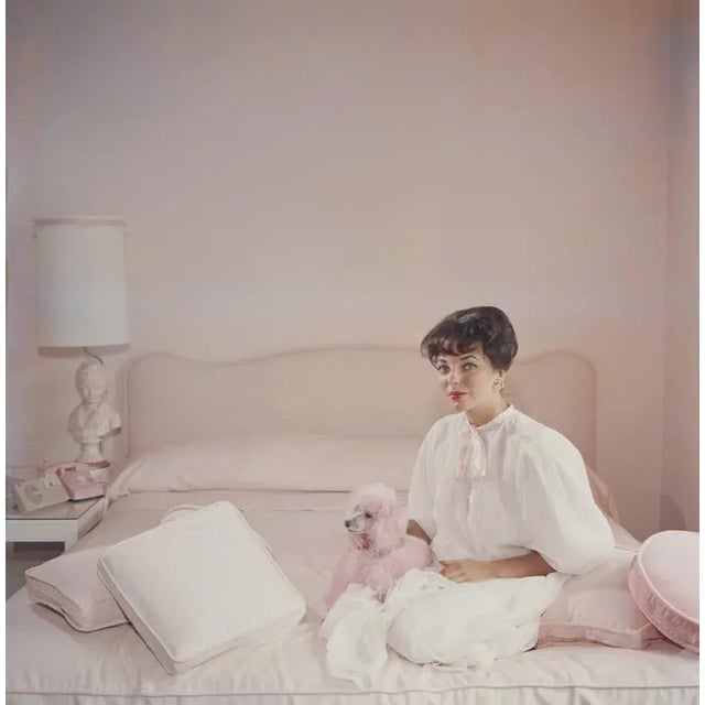 Pink Accessory (1955) Limited Estate Stamped - Giant (Photo by Slim Aarons) Film star Joan Collins in a pink and white...