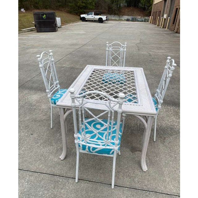 Up for consideration is a beautiful vintage white wicker dining table with metal chairs and blue accents cushions. This...