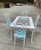 Up for consideration is a beautiful vintage white wicker dining table with metal chairs and blue accents cushions. This...
