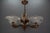French Art Deco 7-light frosted glass, brass, and copper chandelier, circa the 1930s. This magnificent chandelier,...