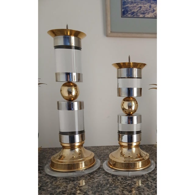 Very rare Mid-Century Modern Hollywood glam candle holders featuring sculptural lucite columns accented with polished...