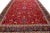 Beautiful antique Tabriz hand-knotted wool rug with a red field. This Persian piece has blue, yellow, and green accent...