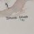Original watercolor painting depicting two sand dollars in a soft coastal palette. The artwork is signed "Dianne Grusso...