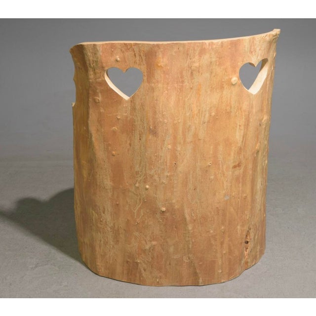 Vintage Swedish Mid Century hand carved pine stump chair or "Kubbstol" featuring charming heart-shaped cutouts and natural...