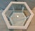 The end table is of the 1960s vintage. It is in excellent condition with a wicker bottom.