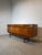 A stunning mid-century Elliotts of Newbury sideboard featuring the brand’s signature sculpted detailing, rich teak...