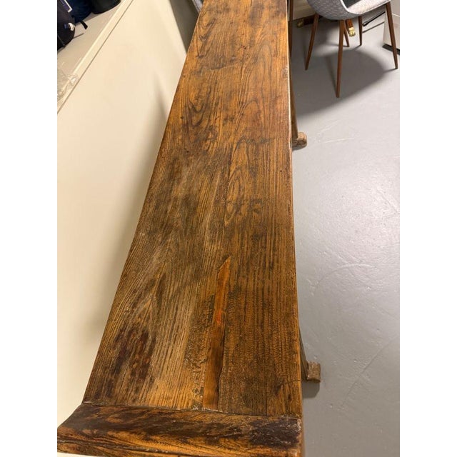 Vintage Carved Asian Console A rustic vintage altar console features legs with panels carved with cherry blossom designs...