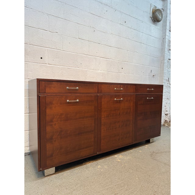Striking Vintage Modern walnut office credenza featuring a clean, architectural design and beautifully figured warm walnut...
