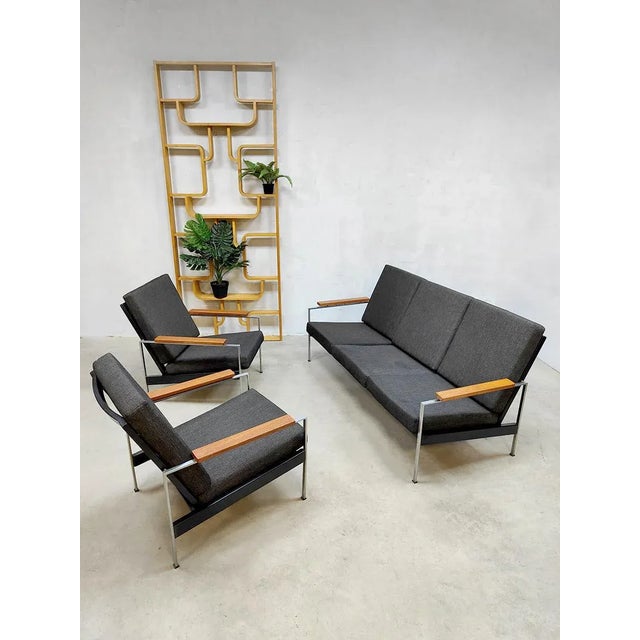 One of a kind! This complete set of 2 armchairs and matching 3-seater sofa is a real Dutch design classic. Designer: Rob...